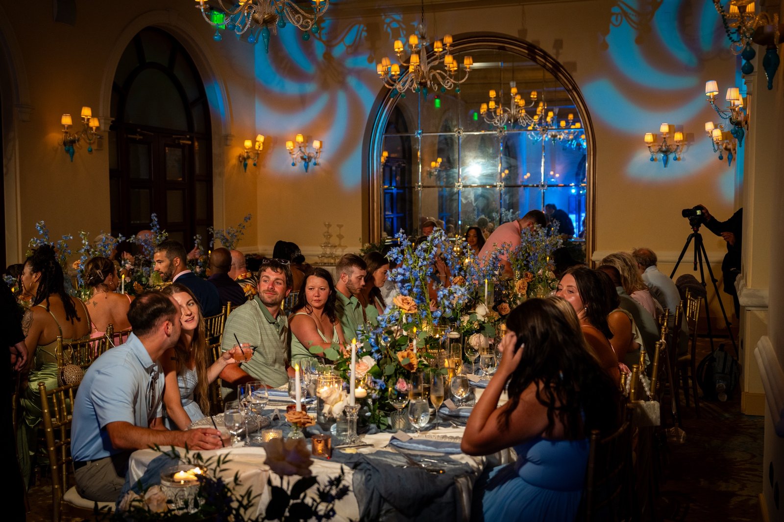 Reception table setting under the ballroom chandeliers